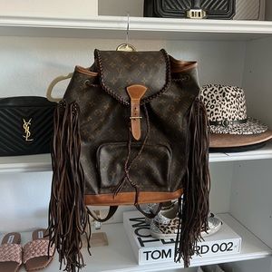 Louis Vuitton backpack, repurposed with fringe for a cute, boho bag.